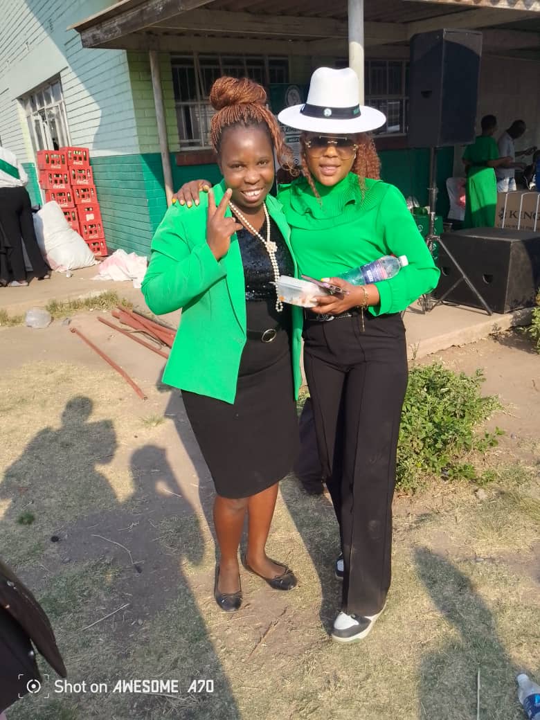 Members in green at gathering